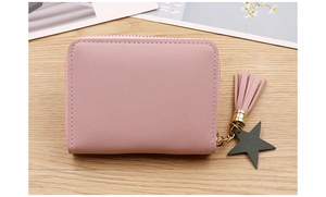 Close-up of pink PU leather coin purse with metal zipper and star tassel detail