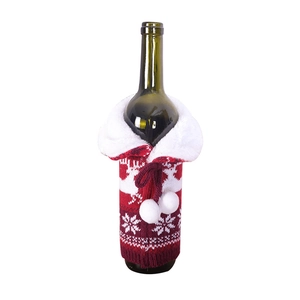 Knitted Christmas wine bottle cover with reindeer patterns and white plush trim