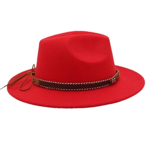 Detailed view of bright red felt fedora hat featuring a brown woven band with tassel detail