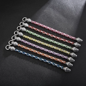 Detailed view of colorful stainless steel snake bracelets in seven vibrant colors