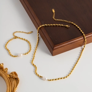 Elegant 316L gold-plated stainless steel jewelry set with natural freshwater pearls