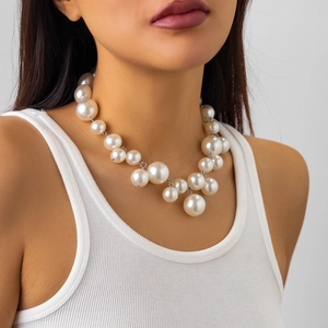 Punk style irregular white faux pearl fringe necklace for women on neck closeup