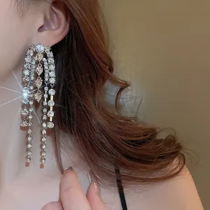 Silver drop earrings with long tassel chains and heart crystal for a luxury look