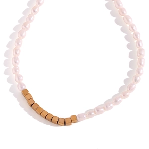 Elegant gold square beads and irregular freshwater pearl splice necklace on white background