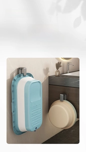 Space-saving stainless steel wall hook holding a blue baby tub and a washbasin