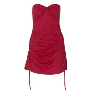 Detail of red ruched strapless top with side drawstrings and adjustable fit fabric