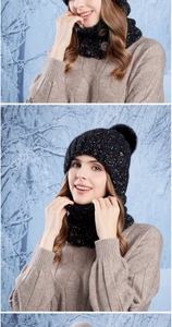 Detailed close-up of winter knit beanie with pom-pom and buttoned neck warmer set