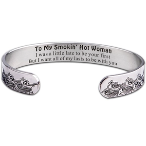 Polished stainless steel open cuff bracelet with inner engraving and wave pattern