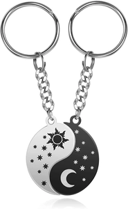 Detailed view of silver and black sun and moon puzzle couple keychains in stainless steel