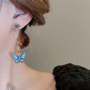 Elegant vintage butterfly drop earrings with blue enamel flowers and silver finish