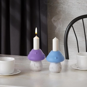 Detail of mushroom candle holders with vertical textures and smooth purple and blue finishes