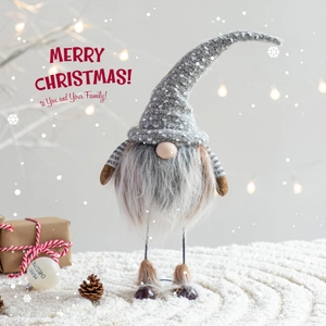 Swedish Christmas Gnome decoration with grey polka dot hat and white beard in festive setting