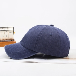 Vintage washed navy blue cotton baseball cap with adjustable strap and curved brim