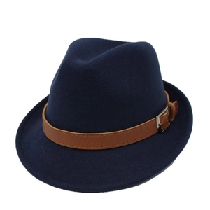 Close-up of retro navy blue wool fedora hat featuring a brown leather band and metal buckle