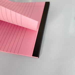 Pink legal pad notebook with horizontal lines and easy-tear perforated design