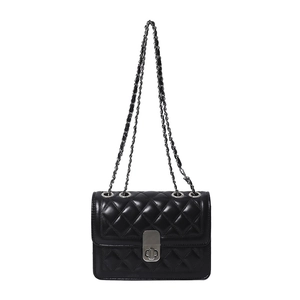 Classic black quilted leather crossbody bag with silver metal chain and lock