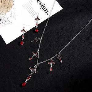 Gothic silver cross jewelry set with red teardrop gems including necklace and earrings