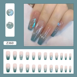Detailed view of Z360 pink gradient press-on nails with 3D floral pearls and rhinestones