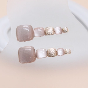 Cat eye and glitter press-on toenails in pink purple and champagne gold finish