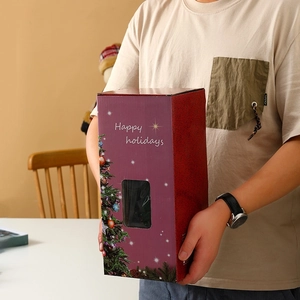 Close-up of a large purple Christmas gift box with Happy Holidays text and tree graphics