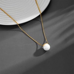 Minimalist titanium steel necklace with a round white pearl on a gold chain