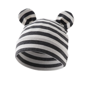 Detailed view of striped baby knit hat with 3D round ears on a clean white background