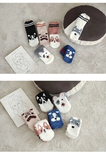 Detail view of six pairs of warm coral fleece socks with cute cartoon animal patterns