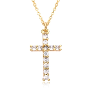 Close-up of gold cross pendant necklace featuring micro-set sparkling round zircon stones