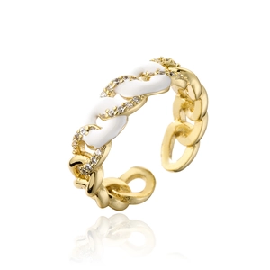 Detail of 18K gold plated chain ring with white enamel and sparkling cubic zirconia