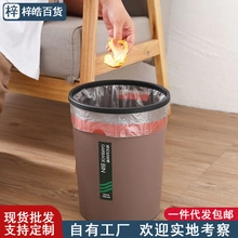Brown plastic desktop waste bin with black pressure ring and red handle liner