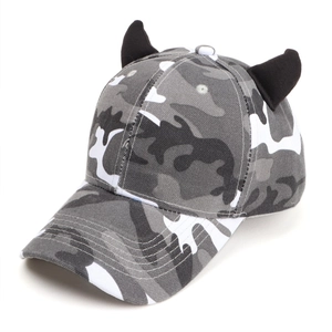 Top view of grey camouflage baseball cap with 3D black devil horns on white background