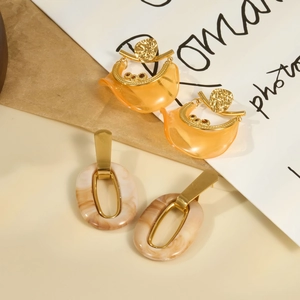 French style resin hoop earrings in orange and marble patterns with gold metal accents
