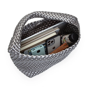 Handwoven silver PU leather tote bag showing large capacity for tablet and daily items