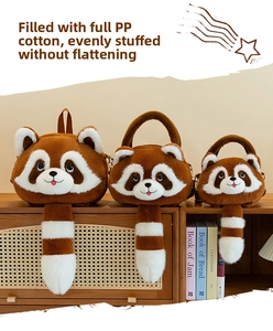 Detailed view of three cute plush raccoon bags with striped tails on a wooden display