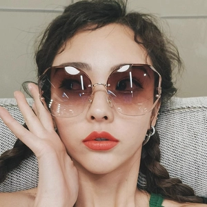 Fashionable rimless oversized sunglasses with brown-to-purple gradient lenses for women