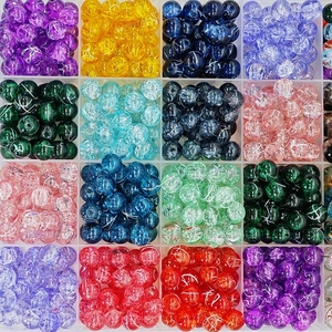 Polished cracked glass bead assortment in 16 colors stored in a plastic organizer box