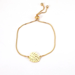 Adjustable gold stainless steel monstera leaf charm bracelet with sliding bead closure