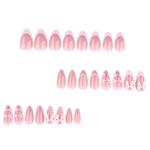 Pink press-on nails with 3D bows, pearls, and heart designs in almond shape style