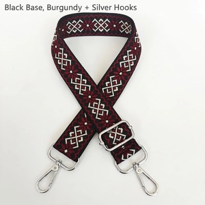 Detail of 3.8cm geometric canvas strap with burgundy patterns and silver metal hooks