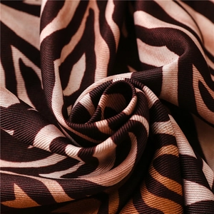Macro view of brown and beige zebra pattern twill fabric showing detailed texture