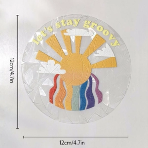 Detail of 12cm circular suncatcher sticker with sun, rainbow clouds and groovy text