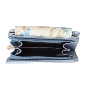 Detail view of the floral pattern on a compact blue faux leather folding wallet with zip