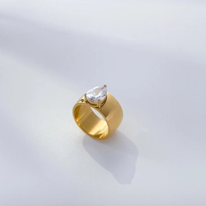 Detail view of 18K gold plated spiral ring with large water drop cubic zirconia