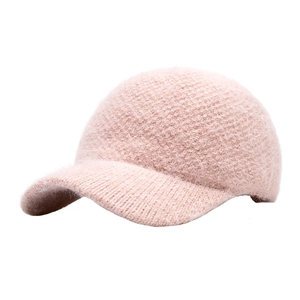 Warm pink knit rabbit fur baseball cap with plush lining and a thick cozy texture