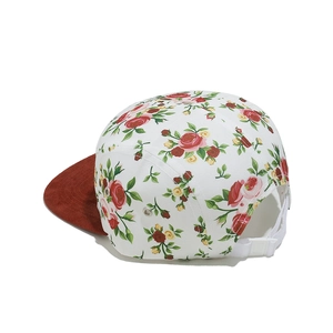 Detailed side view of 5-panel floral hat with red corduroy brim and adjustable buckle