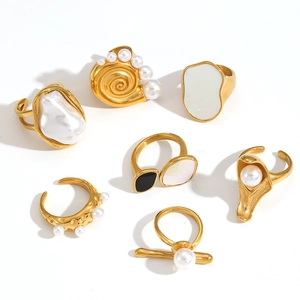Set of baroque pearl and gold plated stainless steel rings in various geometric designs