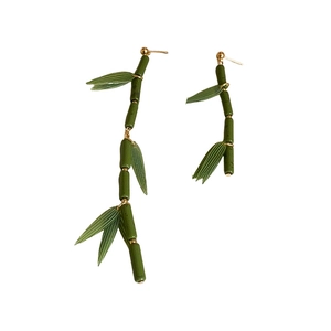 Asymmetric bamboo joint earrings with green resin leaf details and golden studs