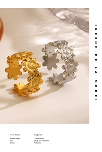 Detailed view of gold and silver sunflower rings with a polished finish and adjustable band