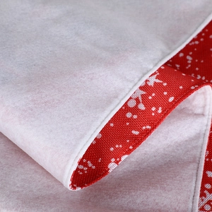 Christmas table runner featuring red snowflake fabric and plush white felt borders