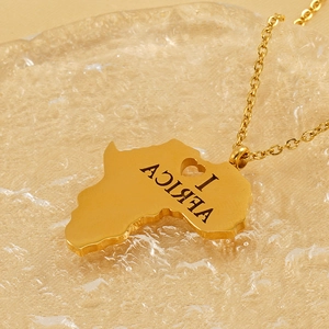 Polished gold stainless steel Africa map necklace featuring a carved heart shape design